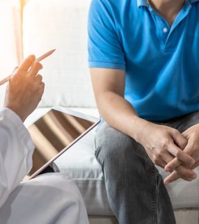 clinician talking with patient